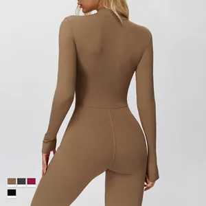 Back view of a thermal fleece-lined yoga jumpsuit with high collar in deep khaki brown