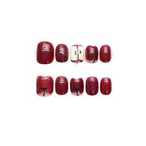 Handgefertigte rote Apfel-Aufdrucknägel mit Glitzerakzenten und süßem Design