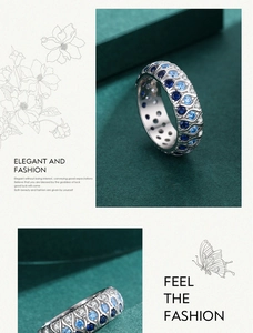 Macro detail of S925 sterling silver ring with blue and clear pavé crystals in wave design