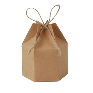 European hexagonal kraft paper candy gift box with natural twine bow tie on white background