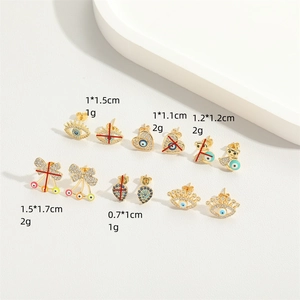 Minimalist gold bow earrings with crystal and evil eye charms for women daily wear