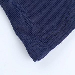 Macro shot of navy blue ribbed fabric with precise double-needle stitching detail