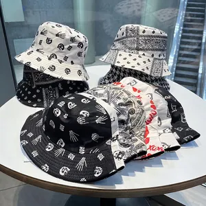 Collection of trendy double-sided bucket hats with paisley, skull, and houndstooth patterns