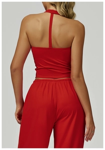 Close-up of the back view showing the halter neckline and high-waisted fit of the red sports set