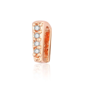 Macro shot of rose gold pendant clasp with four cubic zirconia stones on white background