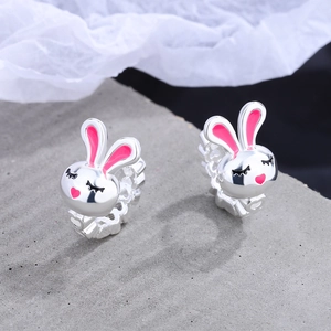 Minimalist silver rabbit ear hoops with pink enamel heart and black eyelash details