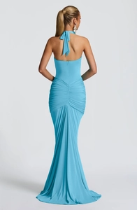 Detail of light blue backless maxi dress with halter ties and horizontal ruching