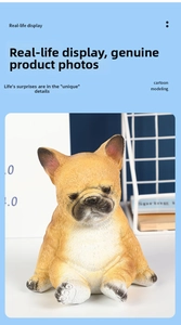 Detail shot of a cute pug resin statue with expressive face on a modern blue desk
