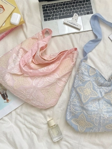 Large embroidered tote bag with butterfly patterns in light pink and blue colors