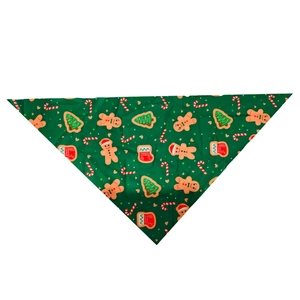 Close-up of green Christmas pet triangle scarf with gingerbread and tree patterns