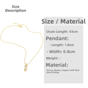 Detail of gold plated necklace with zircon robot pendant and pearl head 43cm chain