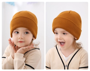 Adorable ginger yellow knitted beanie for children worn by a toddler in detail views