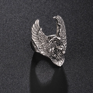 Close-up of vintage silver eagle feather wing ring showing intricate metal textures