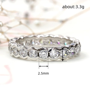 Geometric silver eternity ring with 2.5mm round diamonds and a 4mm polished band