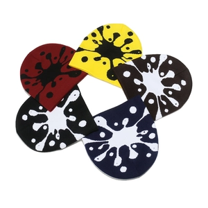 Set of five colorful knit beanies with artistic paint splatter pattern in street style