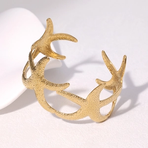 Gold starfish open cuff bracelet with hammered texture finish for women in minimalist style