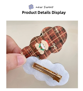 Detail of checkered cloud hair clip with cute puppy and Christmas message engraving