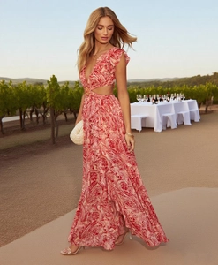 Detailed view of deep V-neckline and waist cutout design on floral bohemian dress