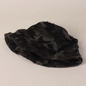 Stylish distressed camouflage bucket hat with ripped details and frayed brim for women