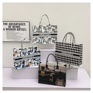 Detailed display of four tote bags with floral, geometric, and city print patterns
