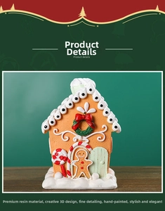 Close-up of resin gingerbread house with snow details and festive Christmas decorations
