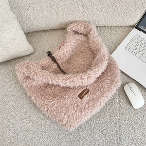 Detailed view of pink fuzzy shearling tote bag with leather logo and drawstring