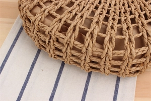Detailed close-up of handmade hollow paper rope woven beach bag with soft fabric lining