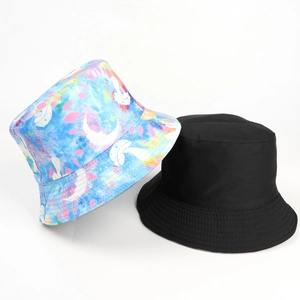 Tie-dye and black reversible bucket hat featuring a colorful butterfly and mushroom print