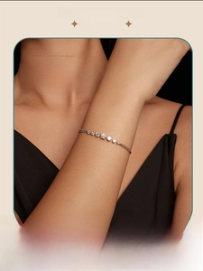 Close-up of a s925 silver moissanite bracelet with seven stones on a female wrist