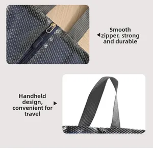 Detail view of smooth metal zipper and reinforced woven handle on waterproof shoe bag