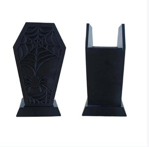 Detail of 3D printed gothic coffin brush holder with spider web relief on white background