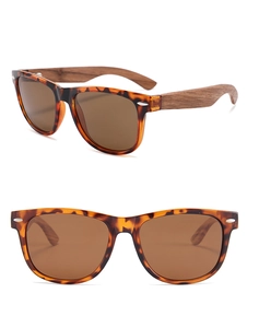 Classic oval tortoise sunglasses with wooden arms shown in front and side views