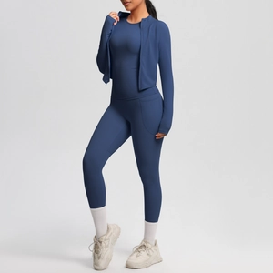 Detail of navy blue women's athletic set with zipper jacket and compression leggings