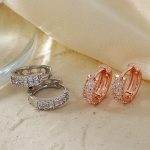 Elegant silver and rose gold zircon hoop earrings set with micro-pave crystals