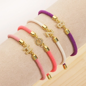 Adjustable woven rope bracelets with gold micro-pave zircon initial charms in various colors