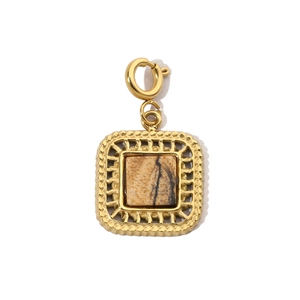 Close-up of golden square pendant with natural stone and spring clasp detail