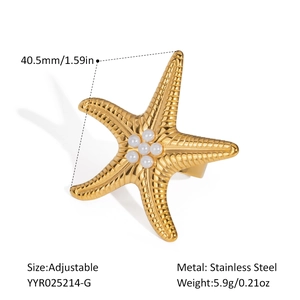 Detailed macro of golden starfish ring with white pearls and adjustable stainless steel band