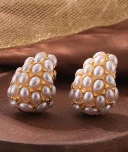 Macro shot of vintage teardrop pearl earrings in 18k gold-plated stainless steel