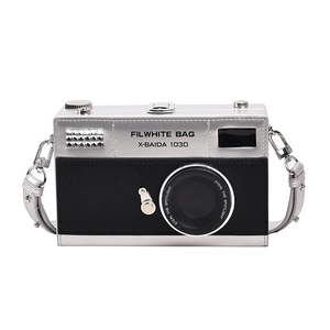Detailed front view of a retro camera-shaped crossbody bag with metal accents