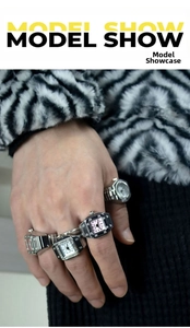 Model showing multiple creative alloy finger watch rings in pink, white and black colors