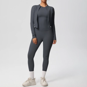 Detailed view of dark grey-blue 3-piece yoga set with slim jacket, vest and leggings