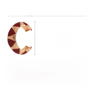 Detail view of a French retro geometric oval open bangle with red and gold alloy textures