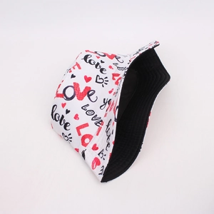 Detail of the white bucket hat showing black and red Love graffiti print and black lining