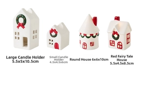 Close-up of assorted ceramic Christmas house candle holders with red and green accents