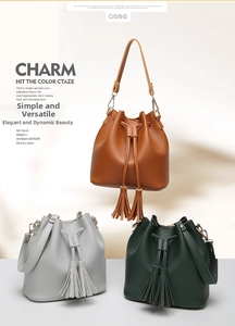 Detailed view of three-color PU leather bucket bags with drawstring and tassel charms