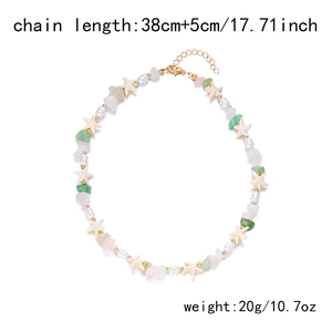 Detail of bohemian necklace with colorful crushed stones and starfish charm, 38cm chain