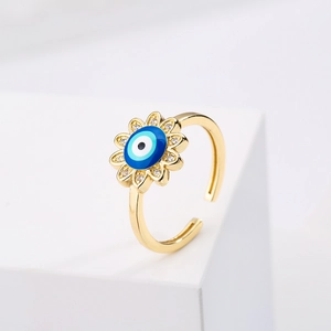 Gold plated evil eye sunburst open ring with zircon petals and blue enamel center