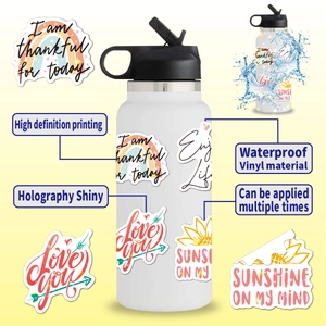 Detail showing waterproof holographic vinyl stickers with motivational quotes on a water bottle