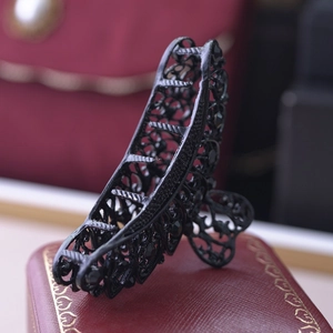 Retro 9cm black hollow alloy hair claw with inlaid gemstones on a red jewelry box