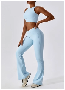 Detail of light blue ribbed yoga set featuring V-shaped waistband and high elasticity fabric
